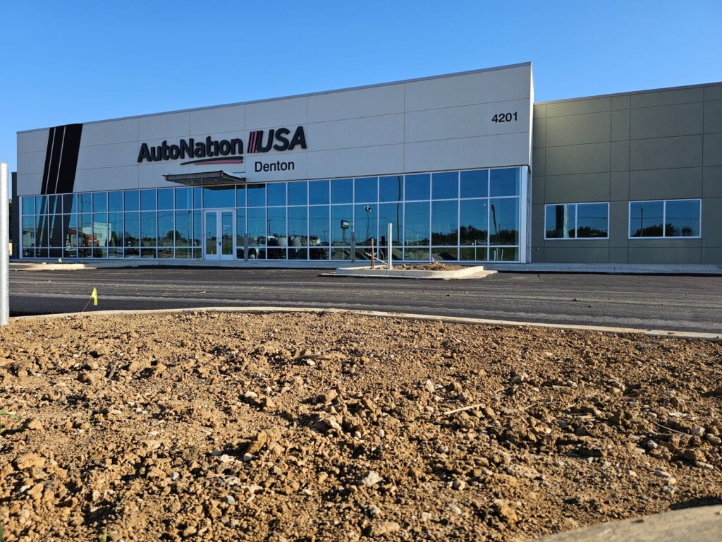 auto nation use denton side view of storefront with glass wall glass doors and two small windows