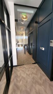 glass door in the middle of a hallway